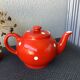 Vintage red teapot with white polka dots