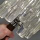 Table lamp with a teak ‘trunk’, silver-coloured metal base, acrylic shade