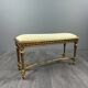 Antique gilded wooden bench in Louis XVI style, 19th century.