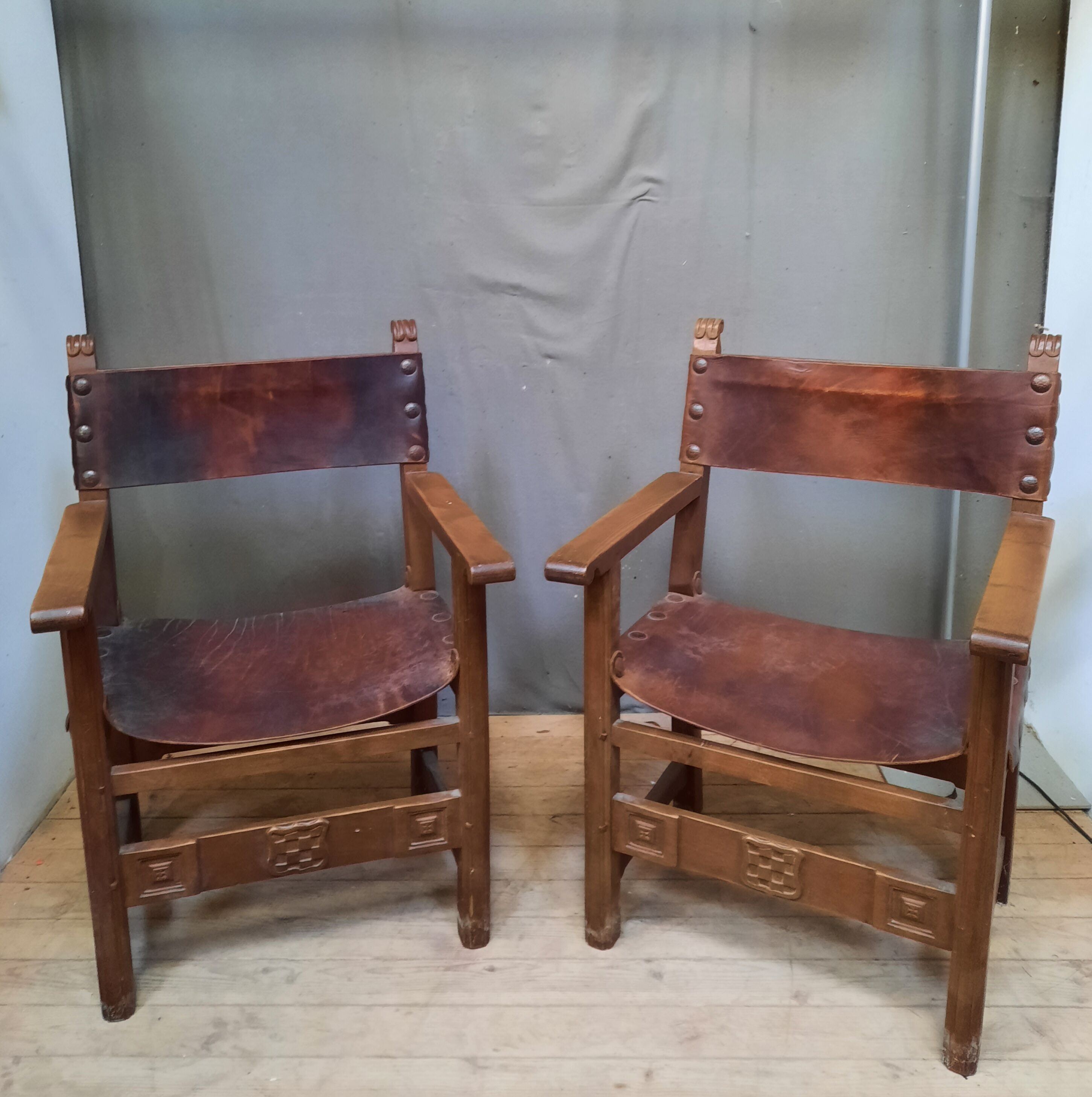 Pair of medieval leather style armchairs