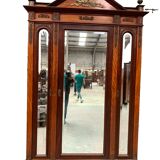 Empitre style three-door wardrobe in mahogany and 20th century veneer