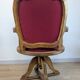 Vintage captain's chair in wood and garnet fabric — a seat with character