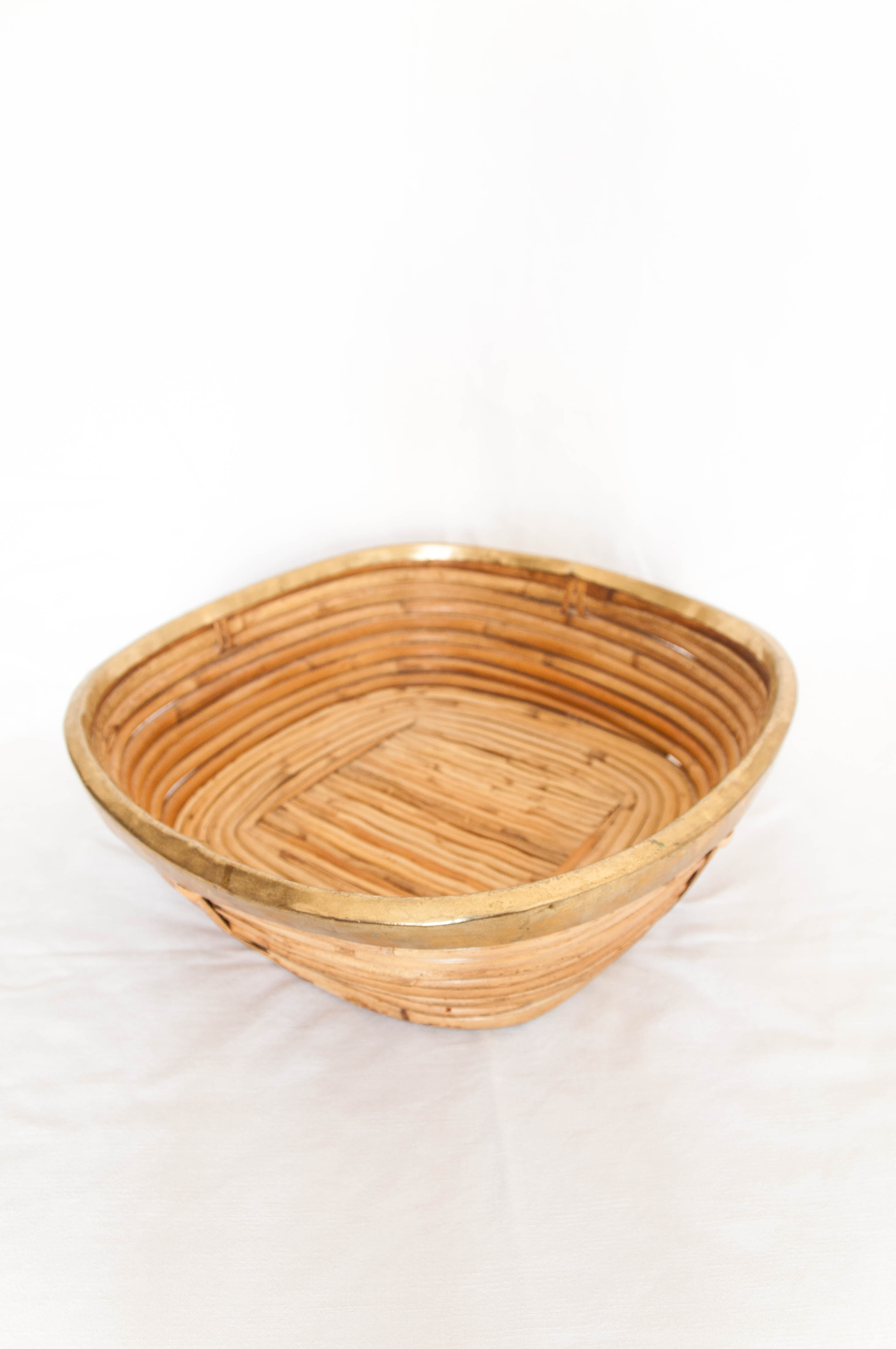 Vintage brass-rimmed rattan basket