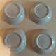 Vintage hollow plates in sandstone series of four marked Longchamp
