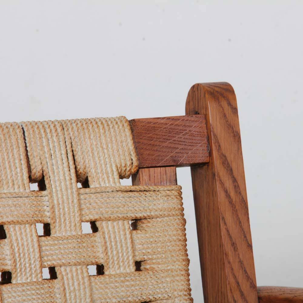 Armchair in solid oak and rope, 20th-century work.
