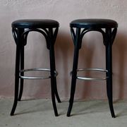 Pair of 1960s bistro bar stools in black and chrome with vinyl shell.