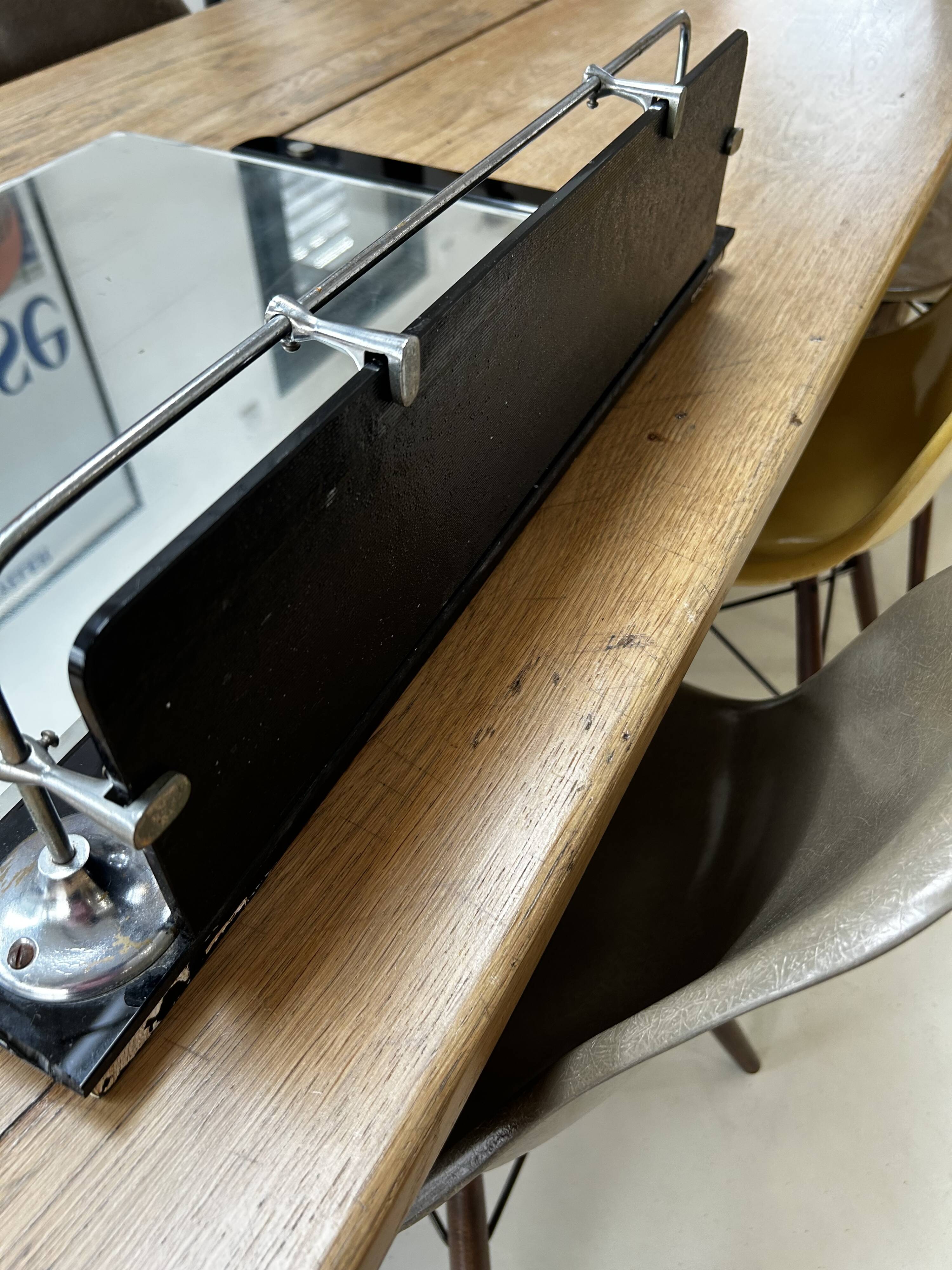 Vintage black mirror from the 1930s/40s with shelf.