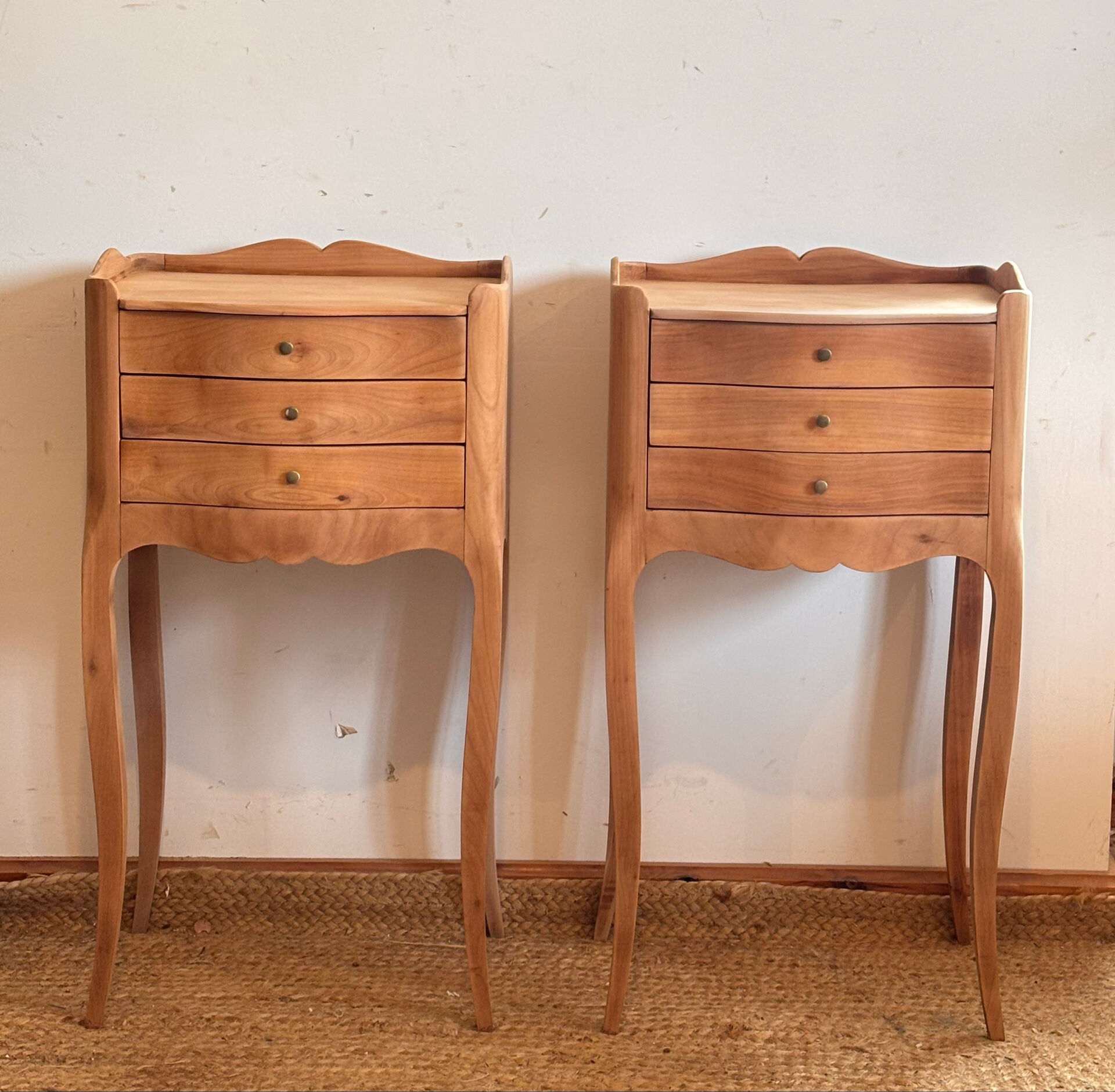 Pair of antique bedside tables / nightstands in raw wood.