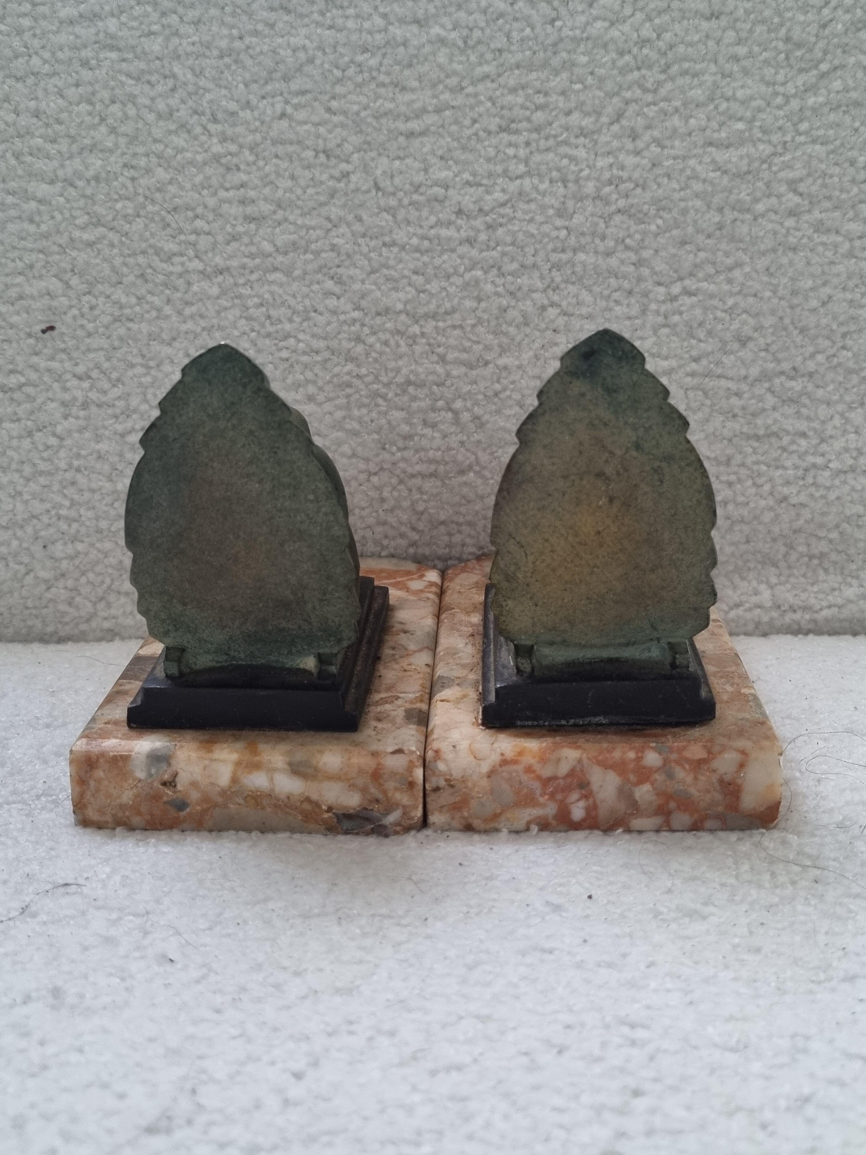 Pair of greenhouse book Art Deco animal sculpture marble base