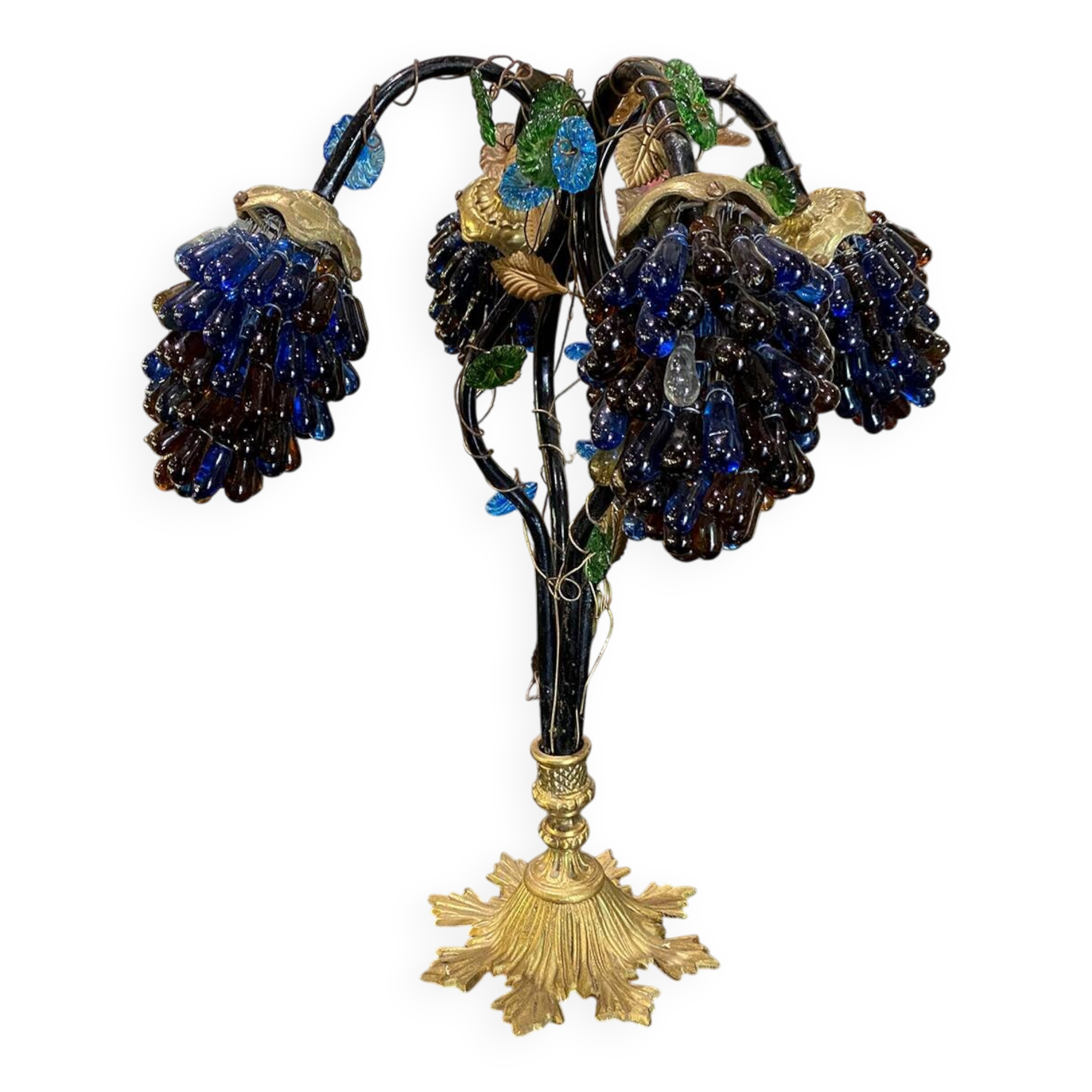 Table lamp with four light arms and globes shaped like bunches of grapes.