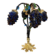 Table lamp with four light arms and globes shaped like bunches of grapes.