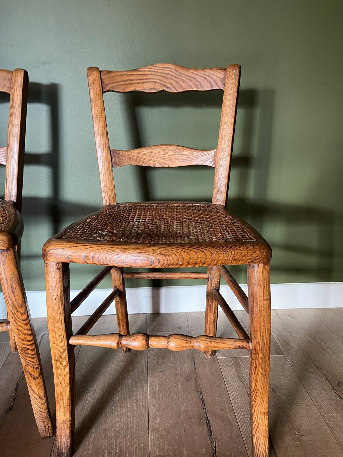 Pair of vintage chairs from the late 20th century with caning.