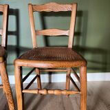 Pair of vintage chairs from the late 20th century with caning.