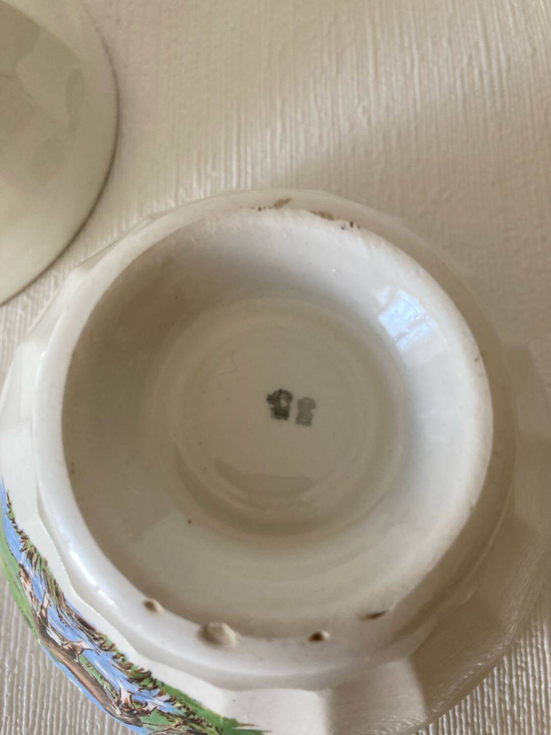 Pair of small faceted bowls with cow illustrations from the 40s and 50s