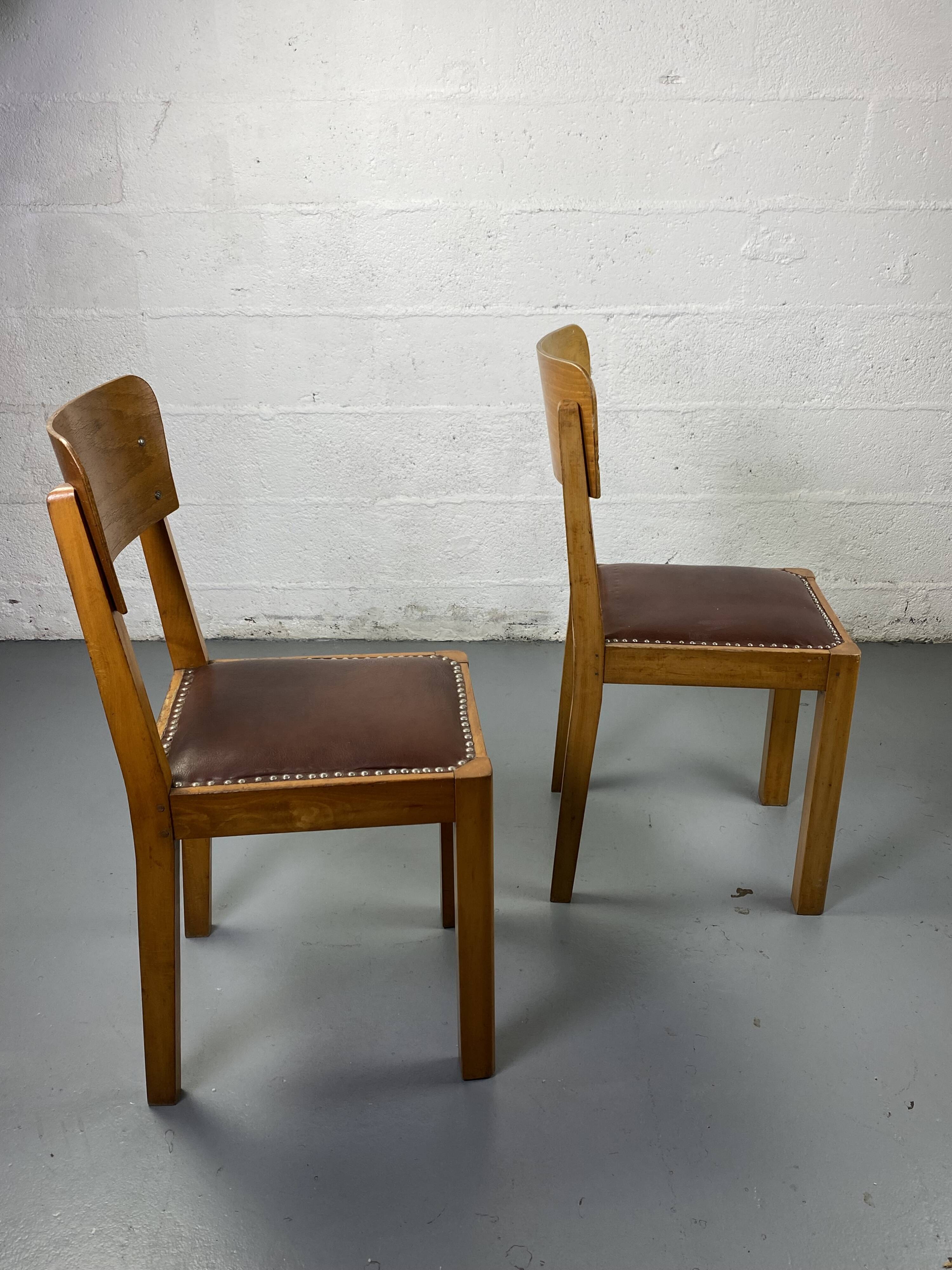 Pair of wooden and leather chairs