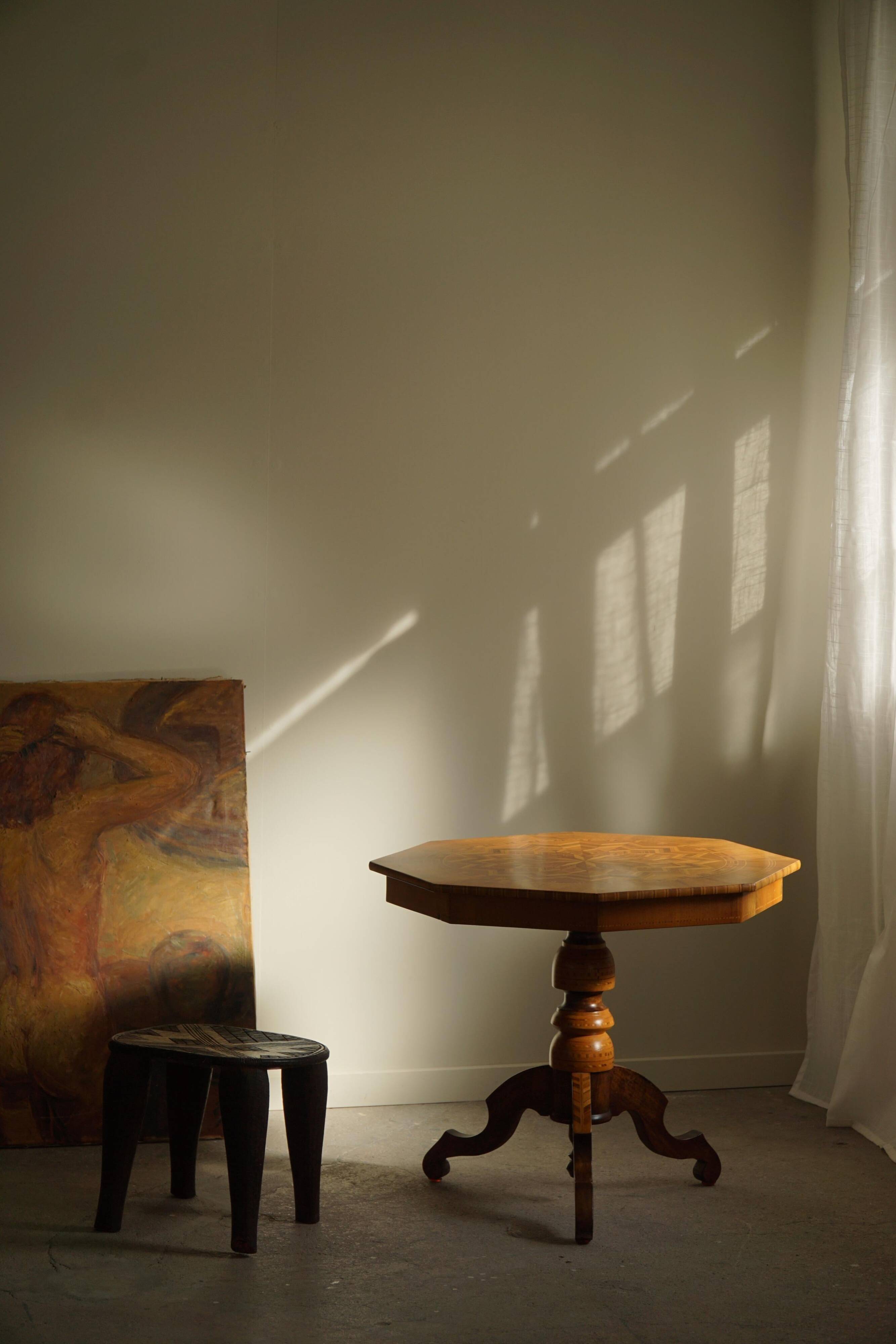 Danish Art Deco octagonal side table in birch with an inlaid top, 1940s.