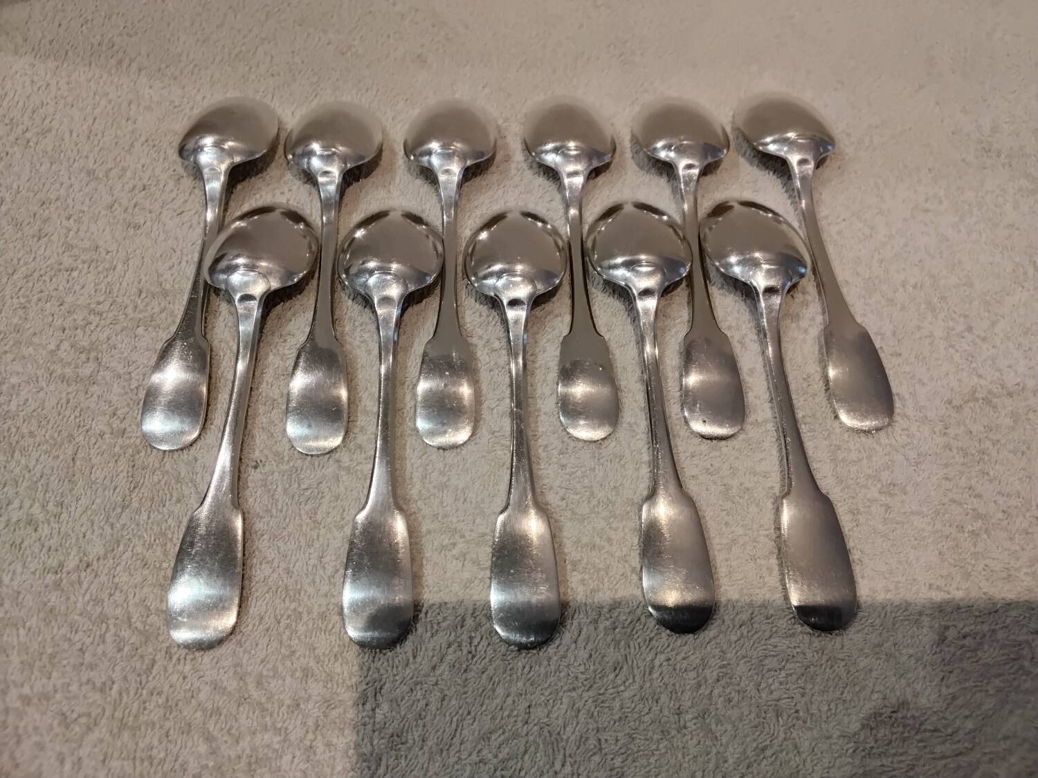 11 silver-plated dessert spoons by Christofle, Cluny pattern, striped
