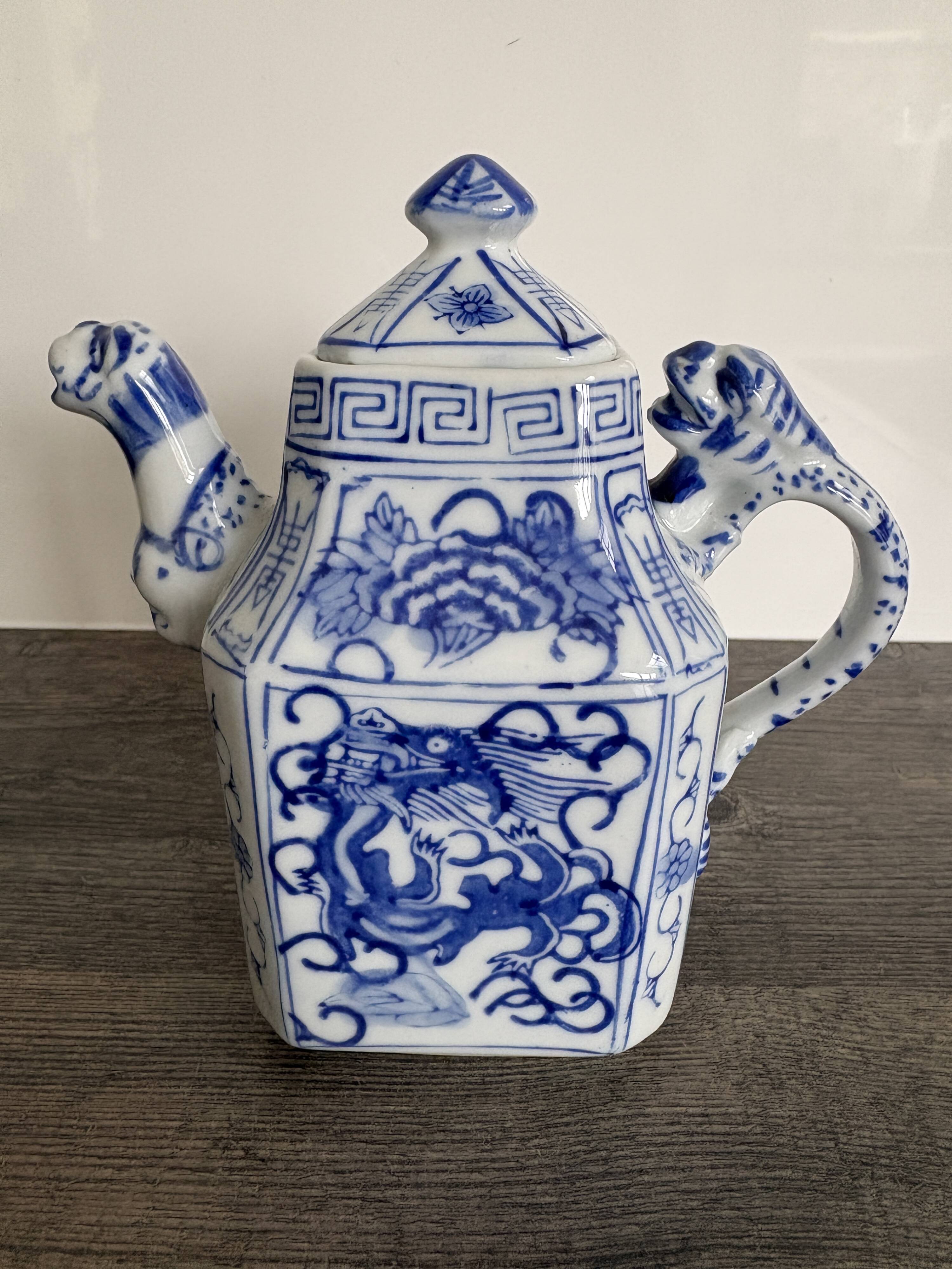 Antique Chinese tea set decorated with dragons.