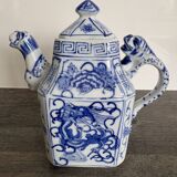 Antique Chinese tea set decorated with dragons.