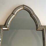Mirror consisting of multi-faceted mirrors and brass garlands, French work, around 1970
