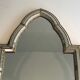 Mirror consisting of multi-faceted mirrors and brass garlands, French work, around 1970