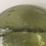 Old demijohn full of bubbles