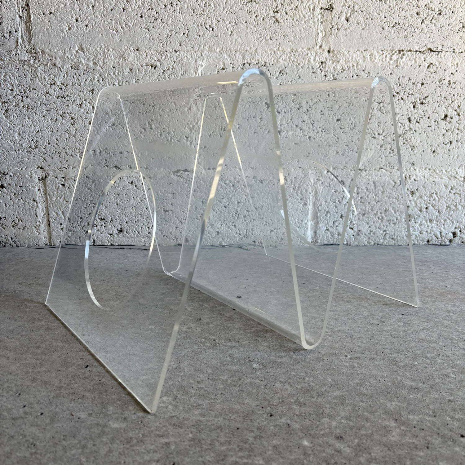 A Plexiglas magazine rack for Roche Bobois, 1970.