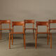 Ensemble de cinq chaises de salle à manger italiennes en cuir cognac, années 1990.