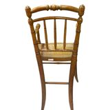 Antique bamboo caned baby chair from the early 20th century.
