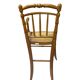 Antique bamboo caned baby chair from the early 20th century.
