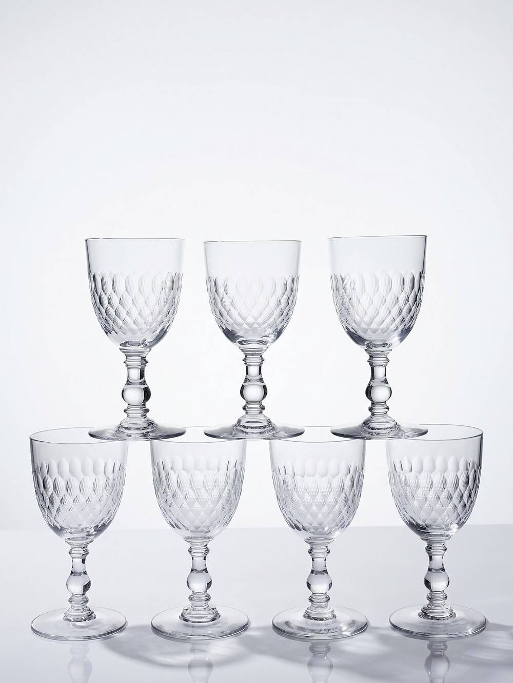 Set of 7 cut crystal port glasses by Baccarat, Richelieu variant.