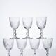 Set of 7 cut crystal port glasses by Baccarat, Richelieu variant.