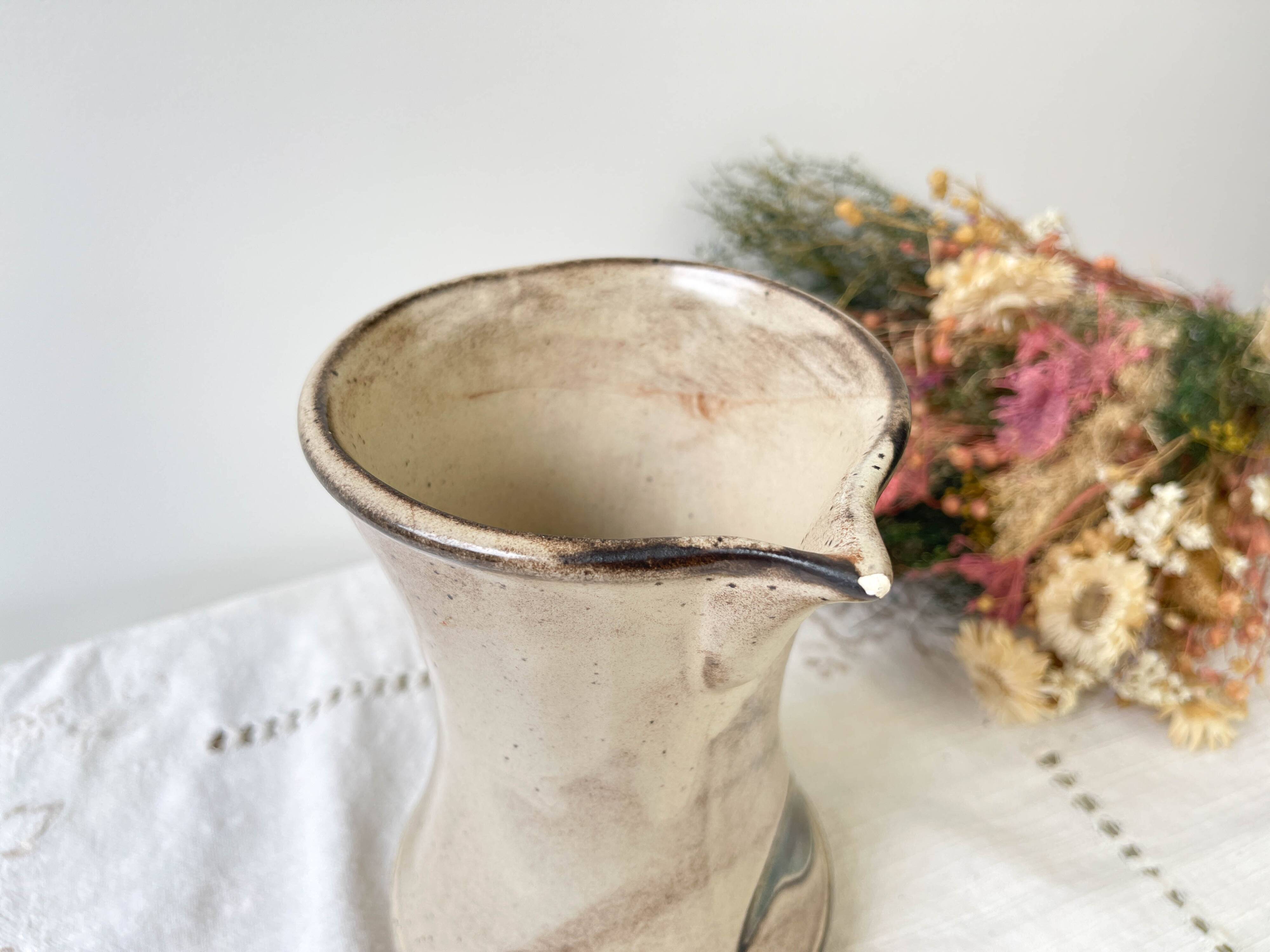 Ceramic pitcher from Les grottes dieulefit with floral pattern from the 1970s