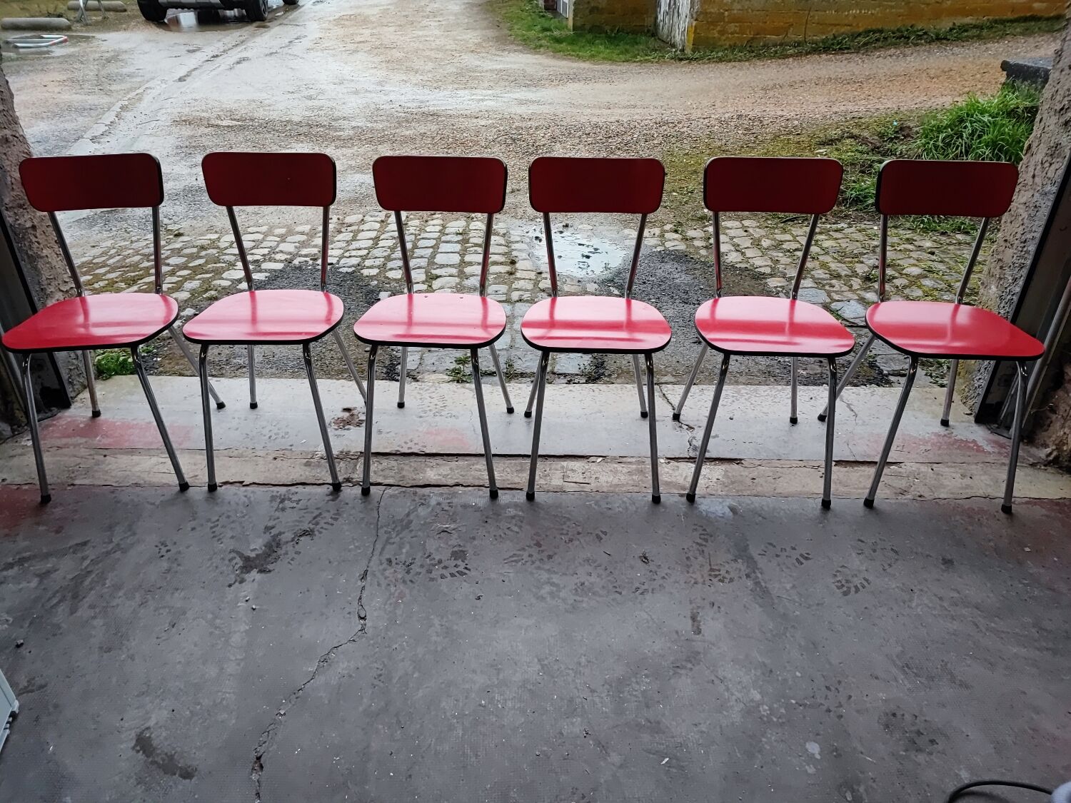 6 red and chrome Formica chairs