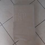 White mestizo sheet with monogram.