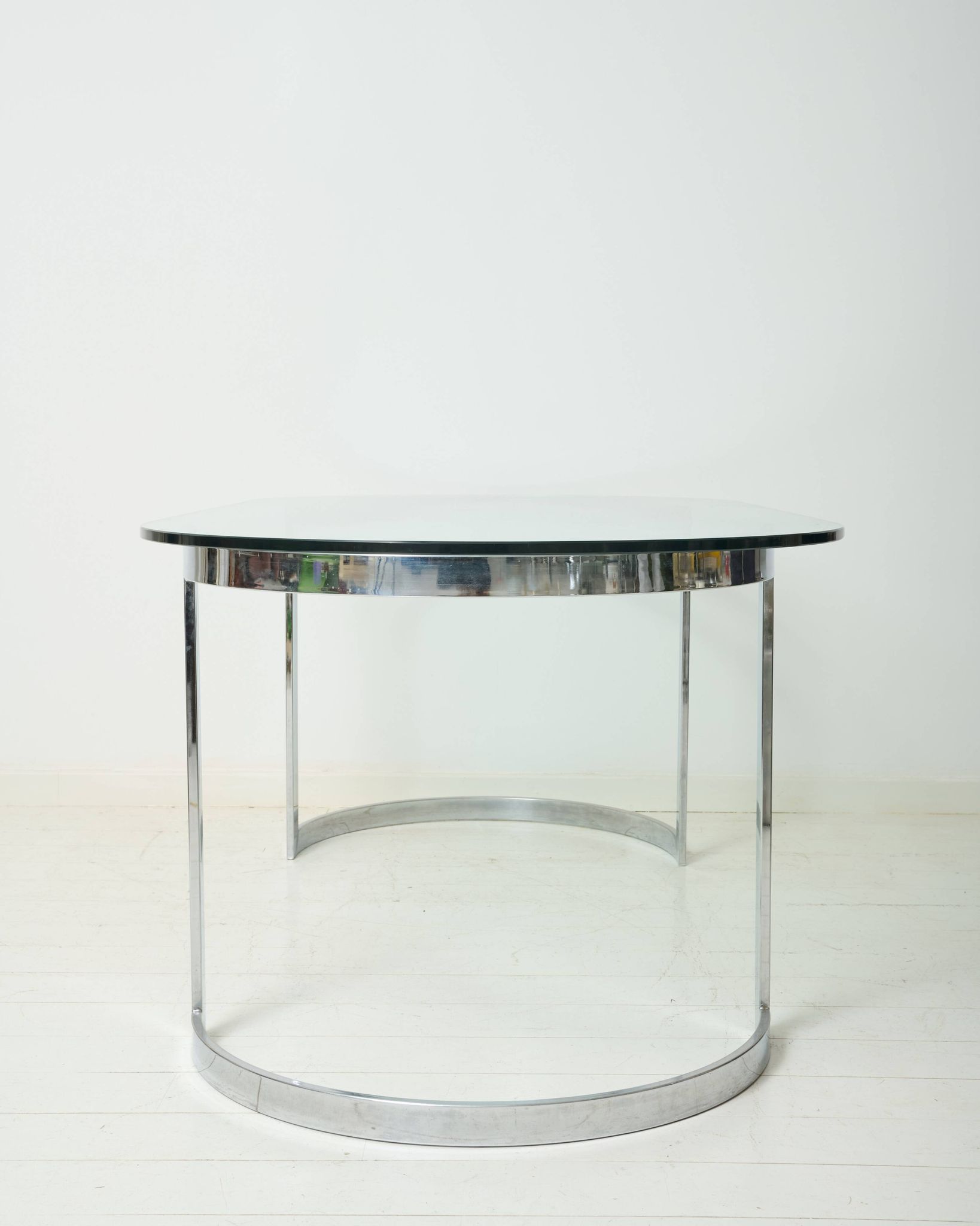 Dining table with a circular base.