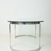 Dining table with a circular base.