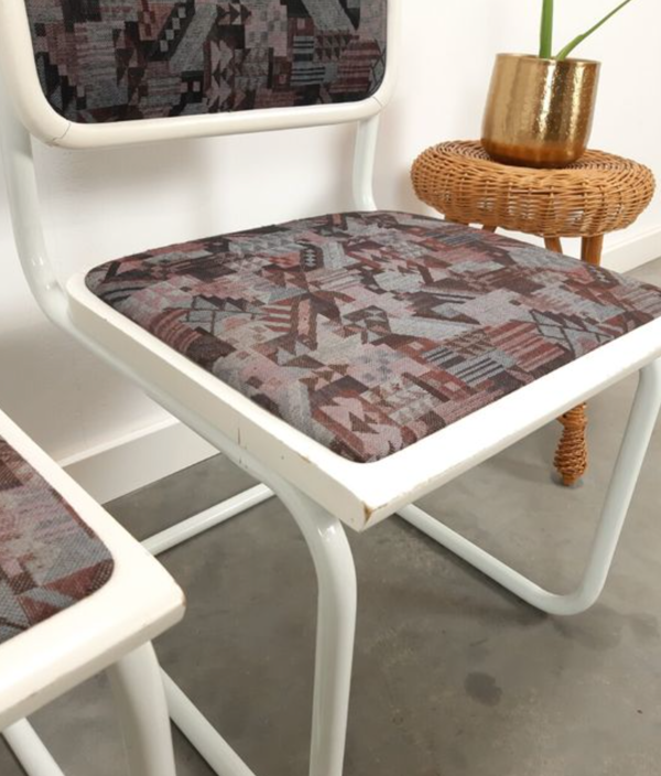 Pair of vintage tubular frame dining chairs