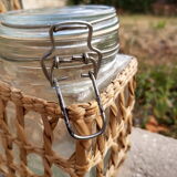 Pair of glass jars and rush