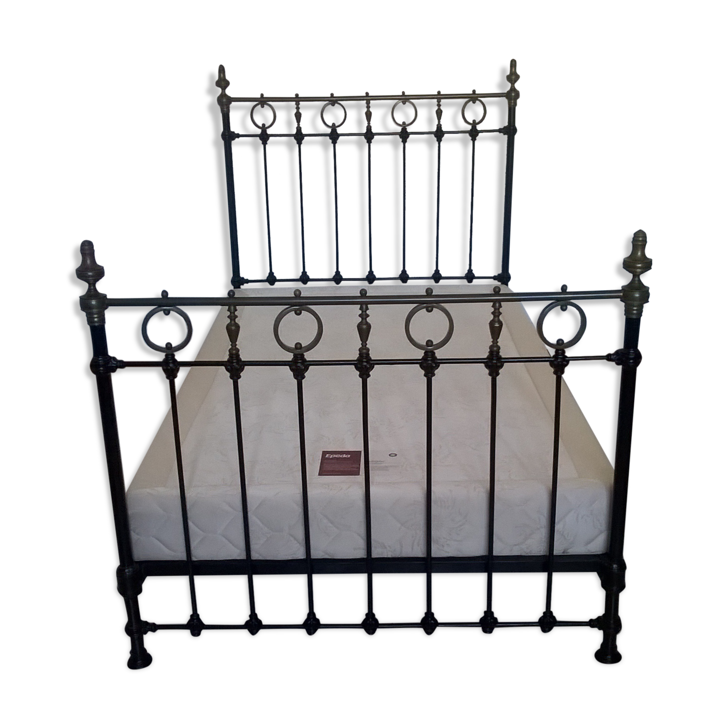 Old bed in black iron and brass