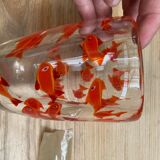 Glass vase with fish inclusions