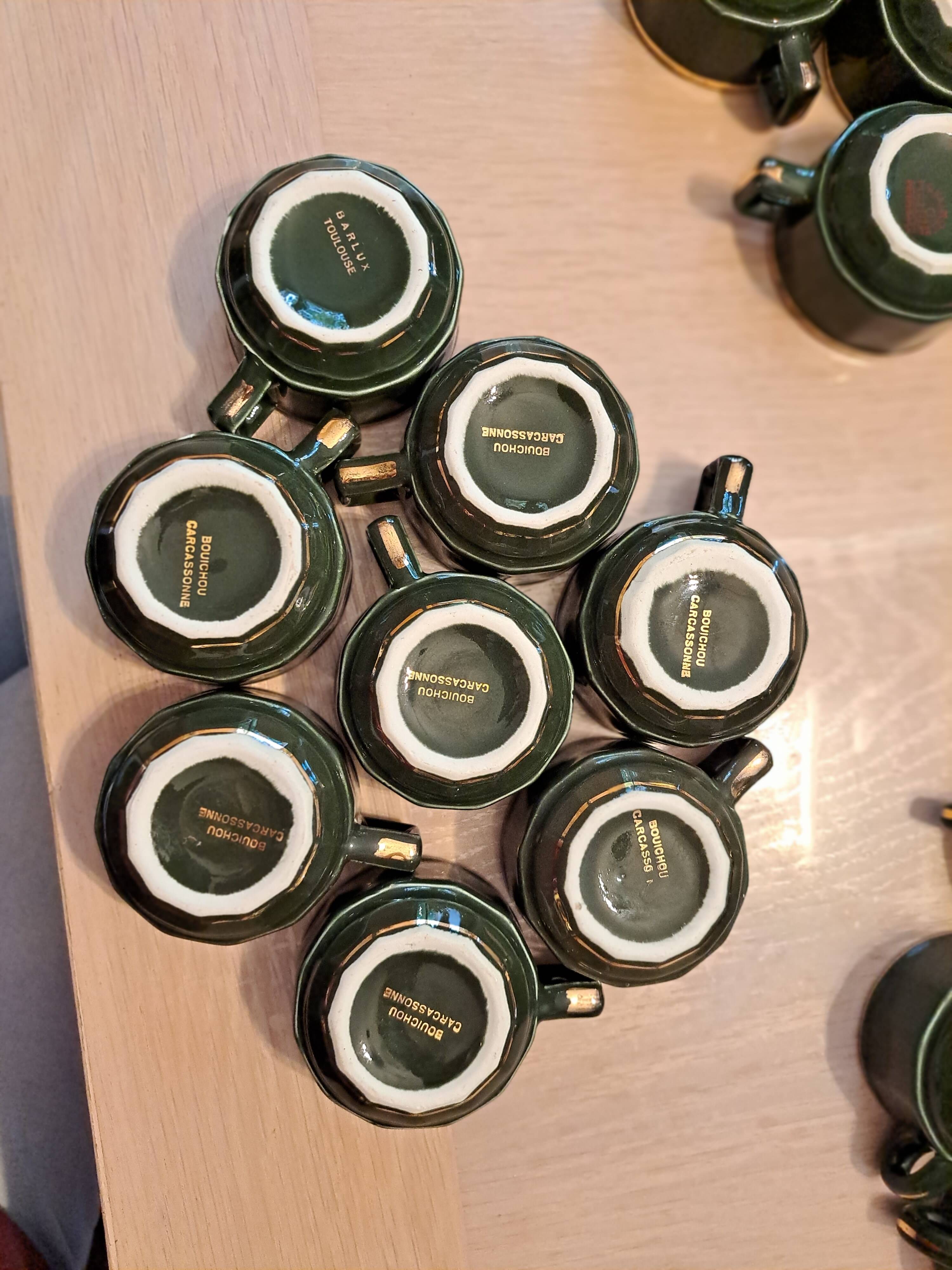 Green and gold coffee cups and sub-cups