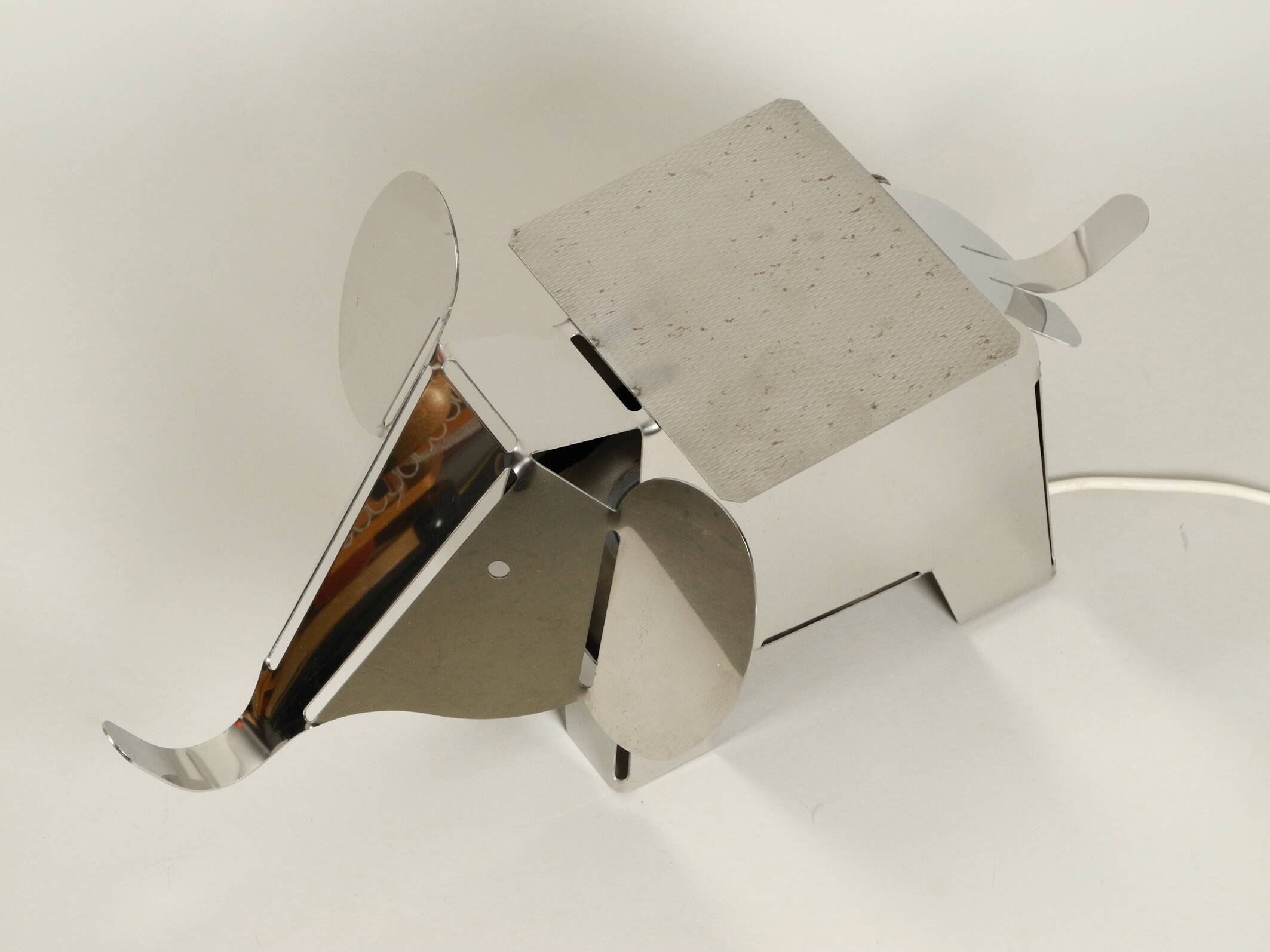 80s heavy metal chrome elephant floor lamp as side table Postmodern design