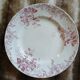 13 mismatched flat plates in ironstone