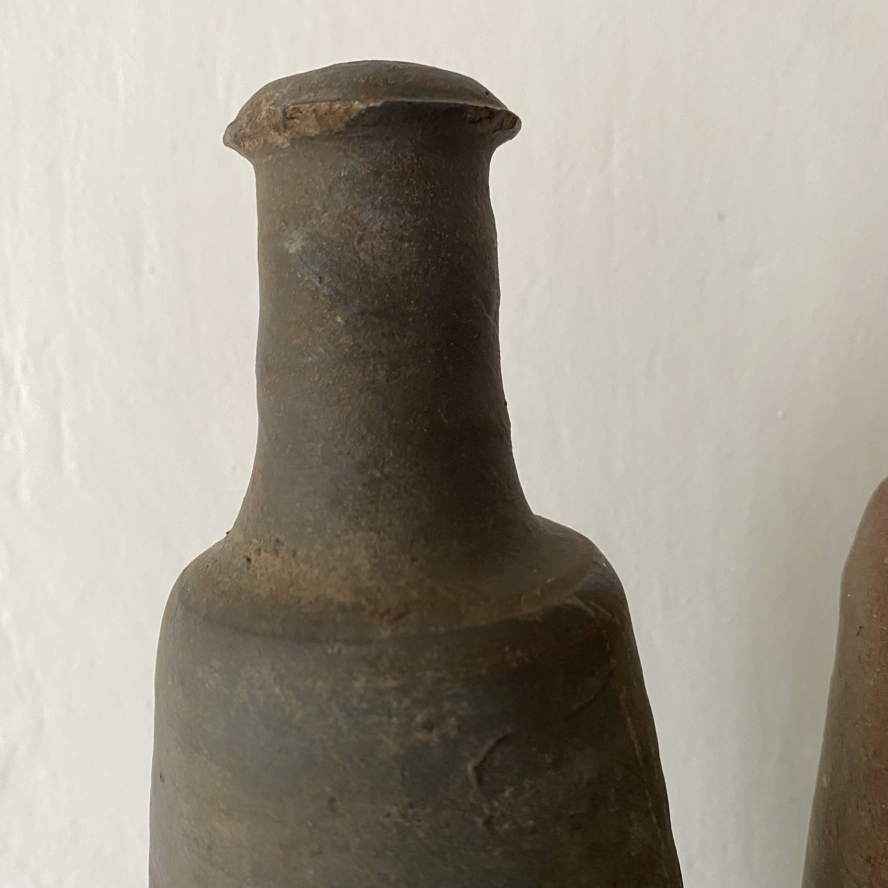 Antique terracotta cider bottles