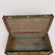 Vintage wooden and metal green travel trunk, circa 1930.