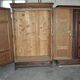 Hungarian wardrobe in carved brown wood from the late 19th century, with 2 doors and a lower drawer.