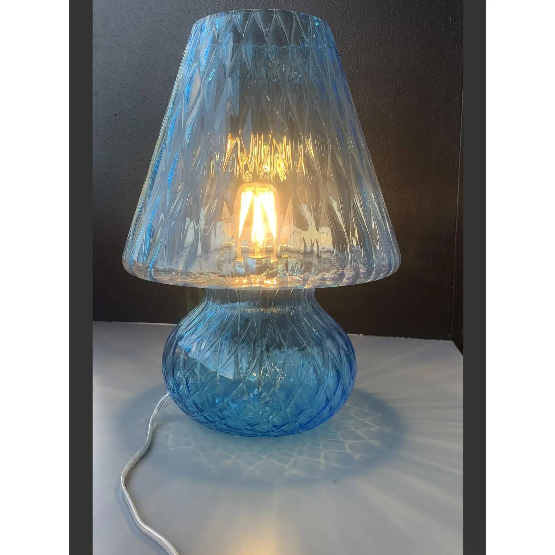 Light blue Murano-style glass with a balloton lamp.