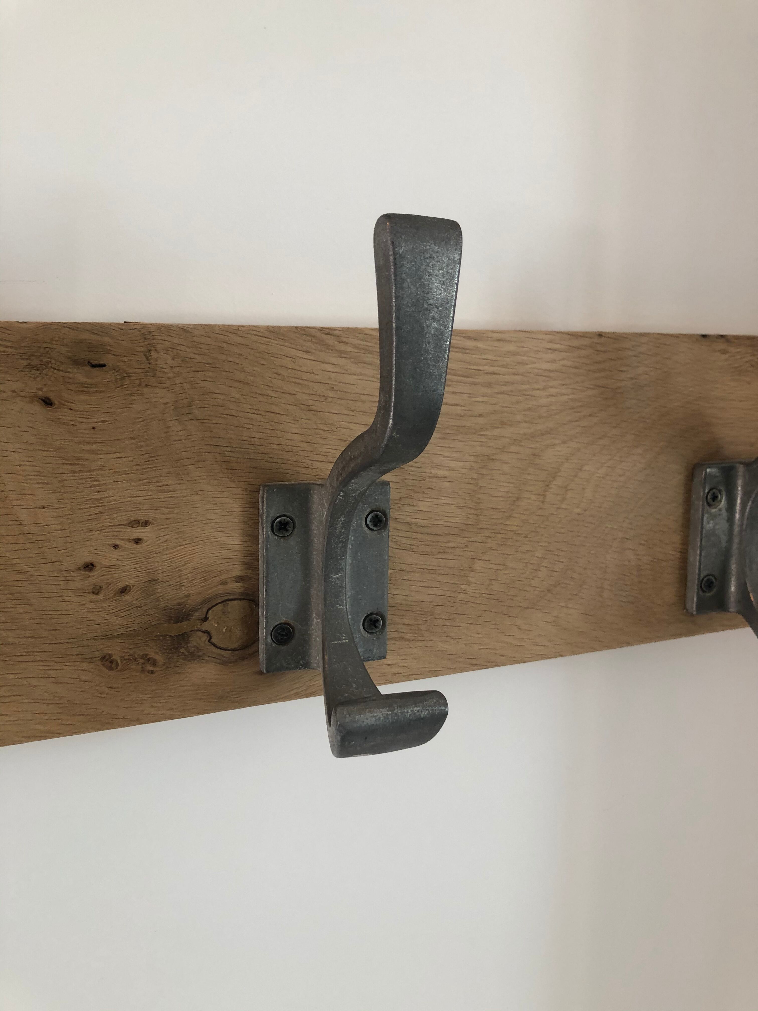 Three-hooked patères on blond oak from a local school in the 50s/60s