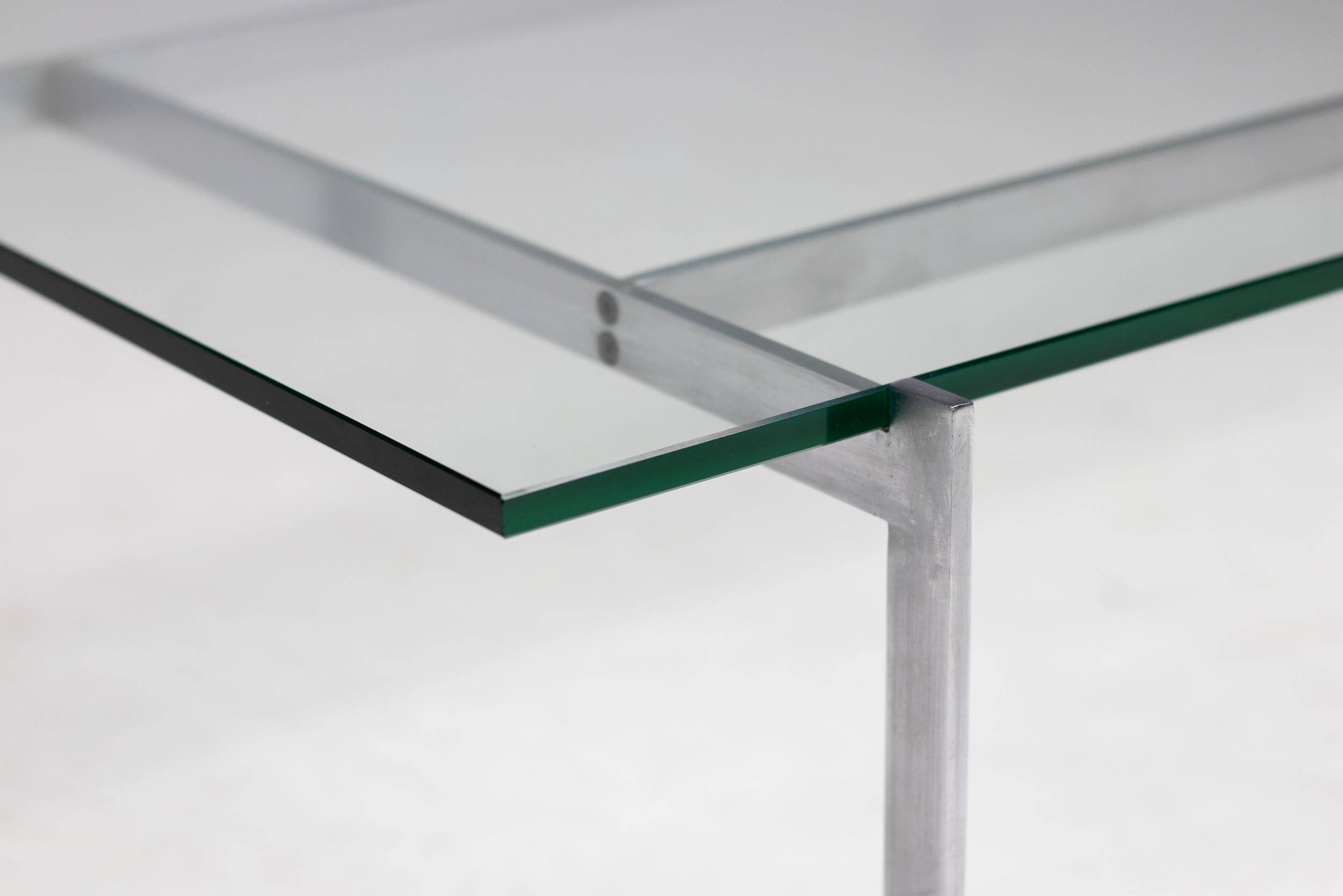 Architectural rectangular coffee table in steel and glass.